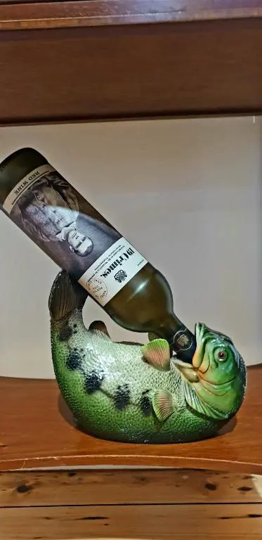 a knife sitting on top of a fish holder at The Osprey Hotel in Kingussie