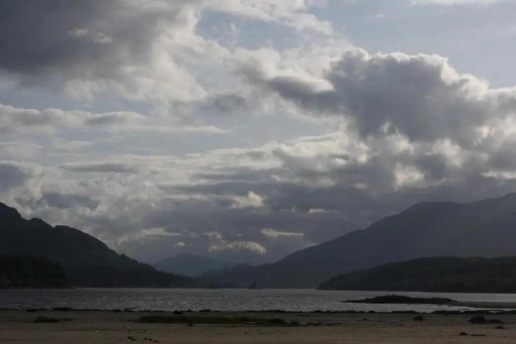 a large body of water with mountains in the background at Wee Wilds in Newtonmore
