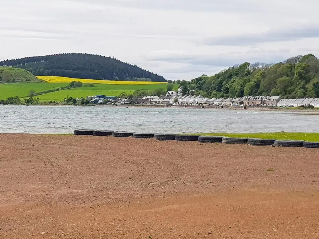 a group of tires sitting next to a body of water at The Red Kite - Uk31003 in Avoch