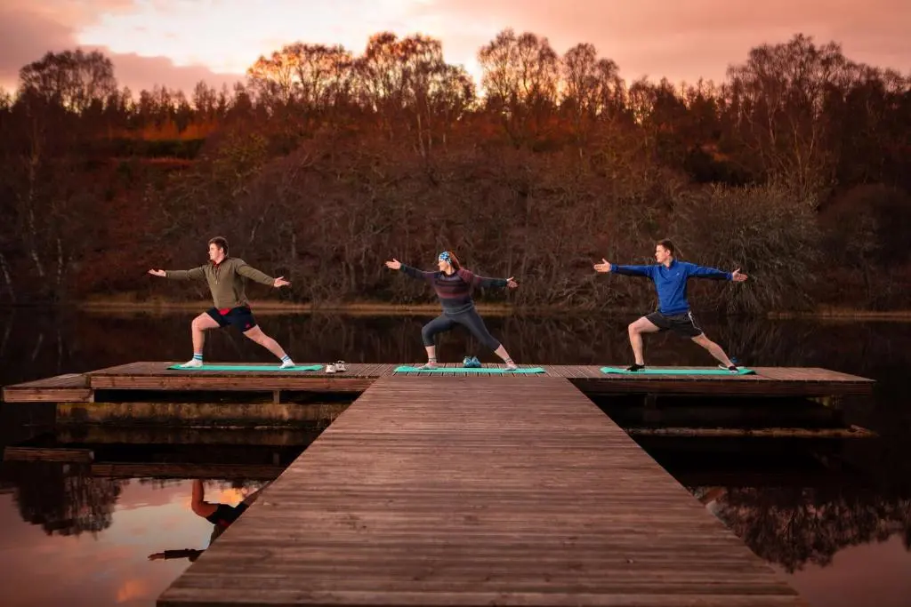 a group of three people standing on a pier at Balnagown Estates Swiss Cottage in Barbaraville