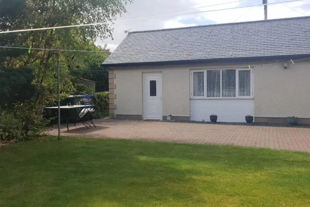a house with a brick driveway in front of it at Arisaig Flat in Inverness