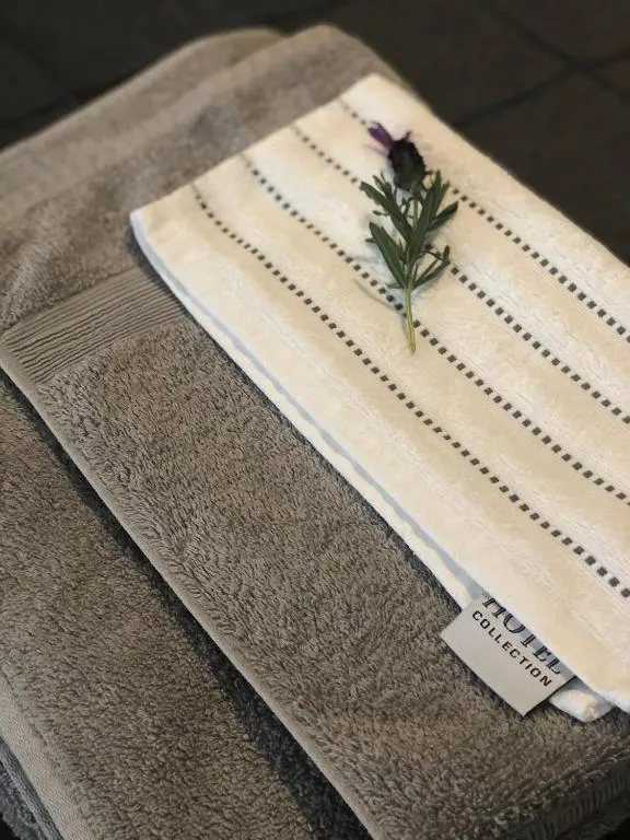 a table with a napkin with a flower on it at The Chalet in Inverness