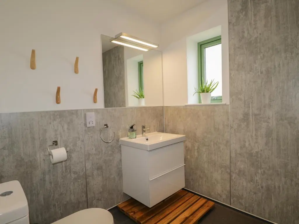 a bathroom with a sink and a toilet at Na Clamhanan in Forres