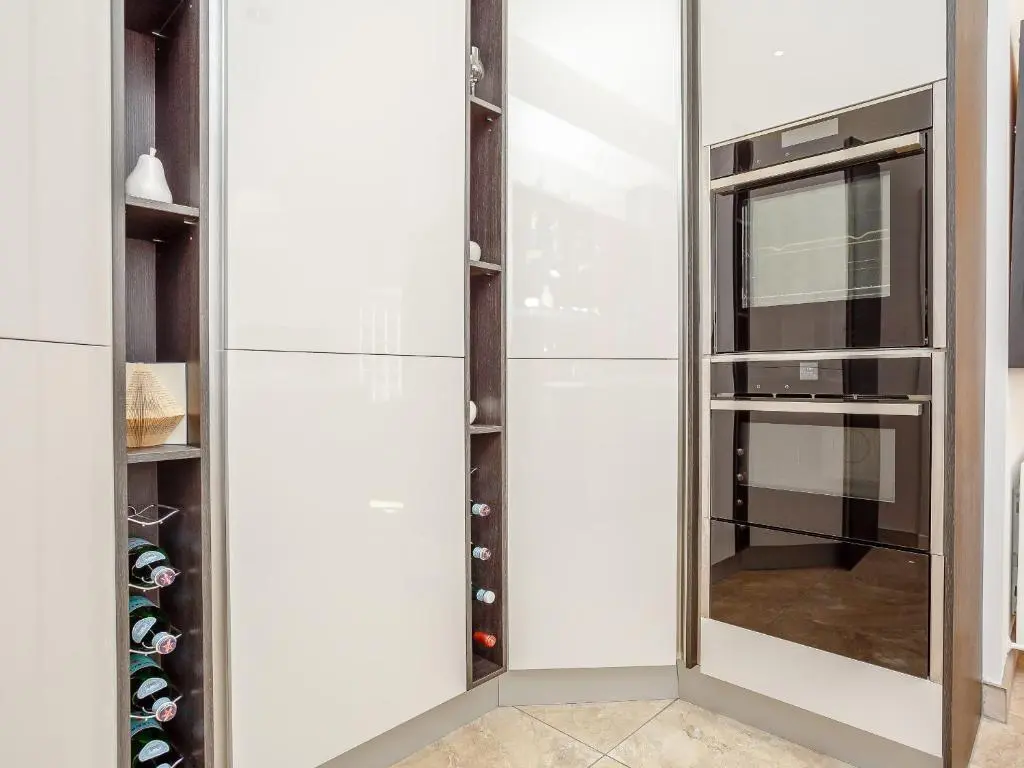 a walk in closet with a glass door at Skene House Court in Dunecht