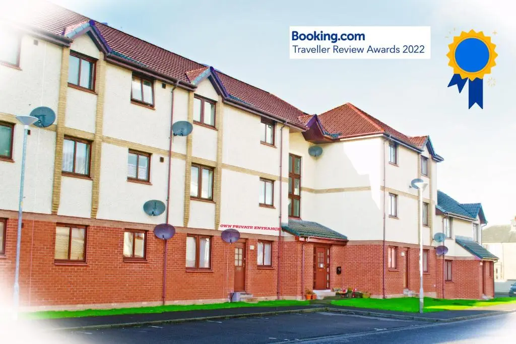a row of houses on a street at Superb 2 Bedroom Flat - Refurbished Dec 2024 in Inverness