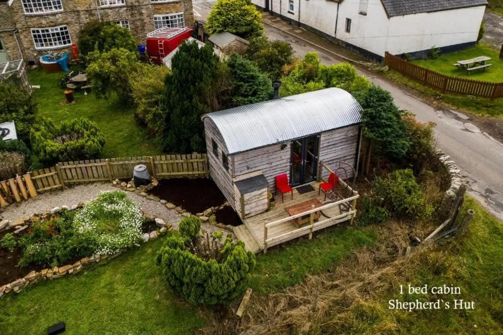 a model of a tiny house in a yard at Culbokie Lodges in Culbokie