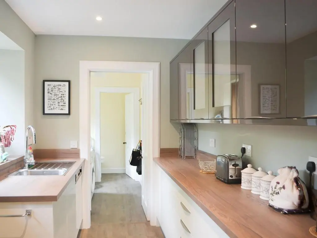 a kitchen with a counter top with a sink and a counter top at Braehead in Nairn