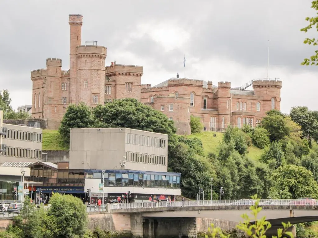 a large castle with a bridge in front of it at The Bell Tower in Inverness