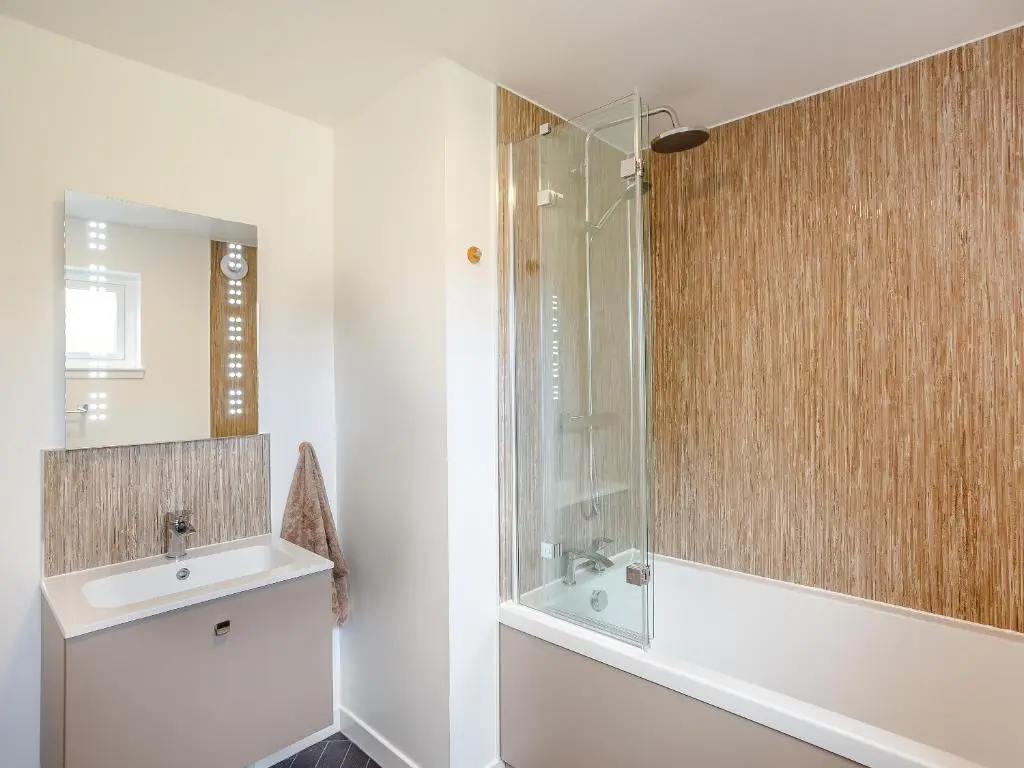 a bathroom with a sink and a shower at Knocknahighle in Cromdale
