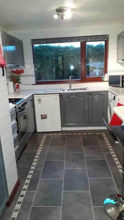 a kitchen with a sink and a large window at 3Bed House - Family Friendly - Close To LochNess in Inverness