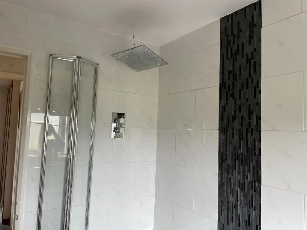 a shower with a glass door in a bathroom at 3Bed House - Family Friendly - Close To LochNess in Inverness