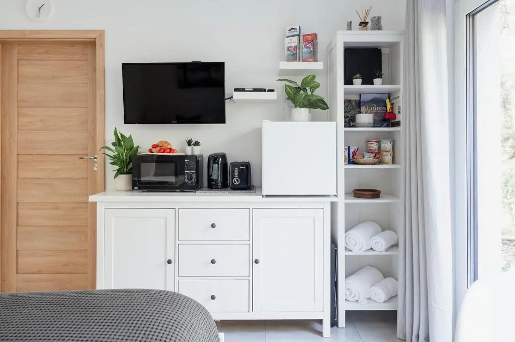 a white cabinet with a tv on top of it at Siskin Guest Suite in Kinrara