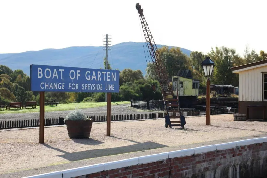 a sign for a boat of garden change for spaceship limbo at The One - Chalet in the Cairngorms in Boat of Garten