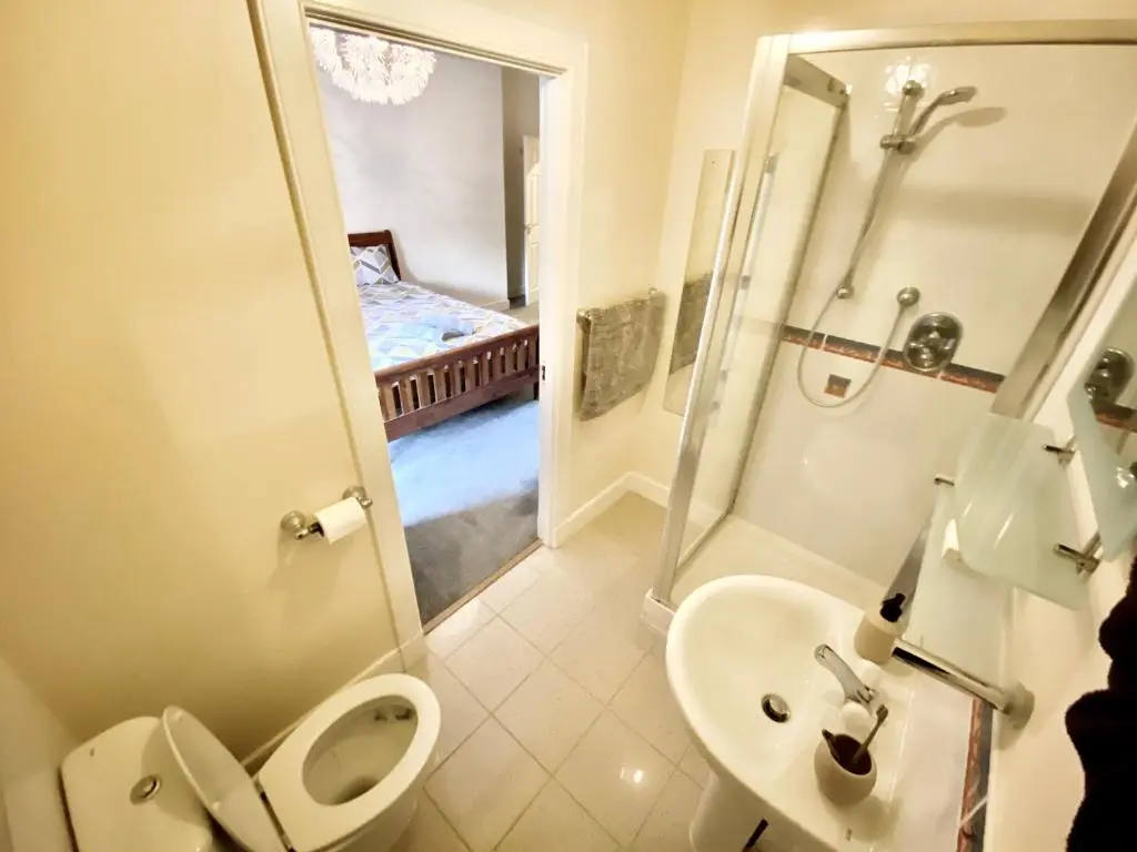 a bathroom with a toilet and a sink and a shower at Serviced Accommodation Moray Lesmurdie House, Elgin - Free Parking, Free WiFi in Elgin