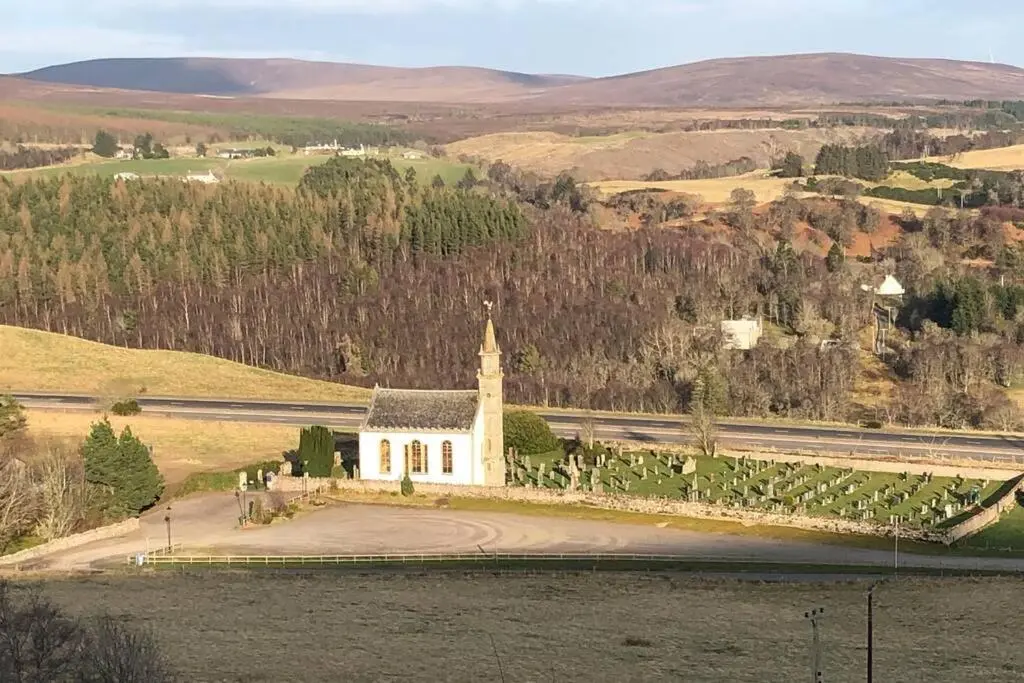 an aerial view of a church in a field at The Annex at Bonnieview in Inverness