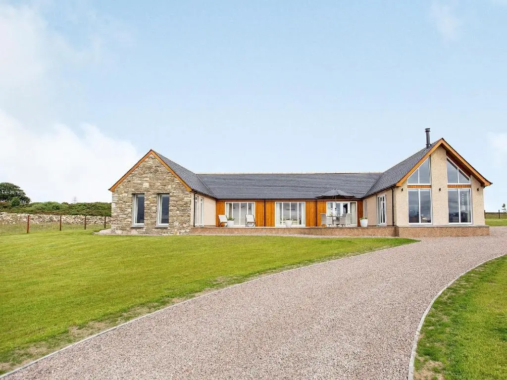 a house with a gravel driveway at Morven View in Dunbeath