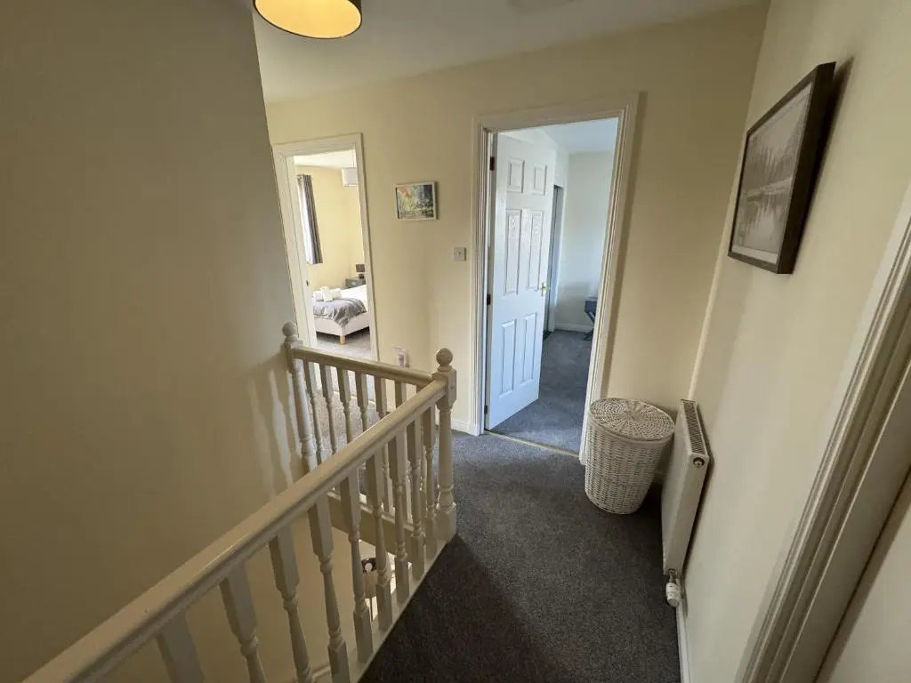 a hallway with a stairway leading to a room at No 25 Inverness - Home from Home in the Highlands in Inverness