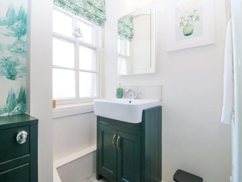 a bathroom with a sink and a window at North Wing - Pitmedden Gardens in Ellon