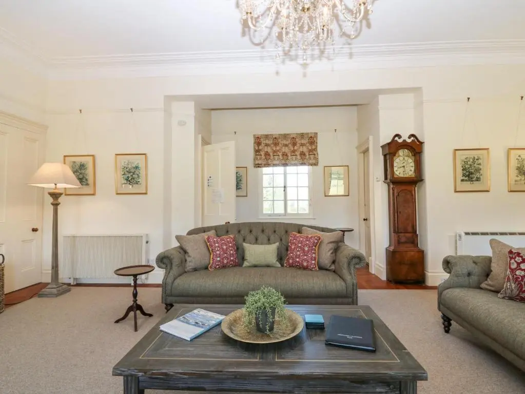 a living room with a couch and a table at North Wing - Pitmedden Gardens in Ellon
