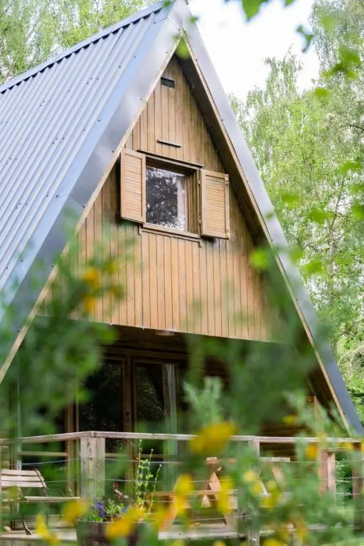 a house with a window on the side of it at Chalet Rowan Cottage by Interhome in Inverness