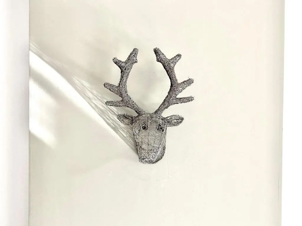 a reindeer head with antlers on a white background at Serviced Accommodation Moray - Lesmurdie House in Elgin