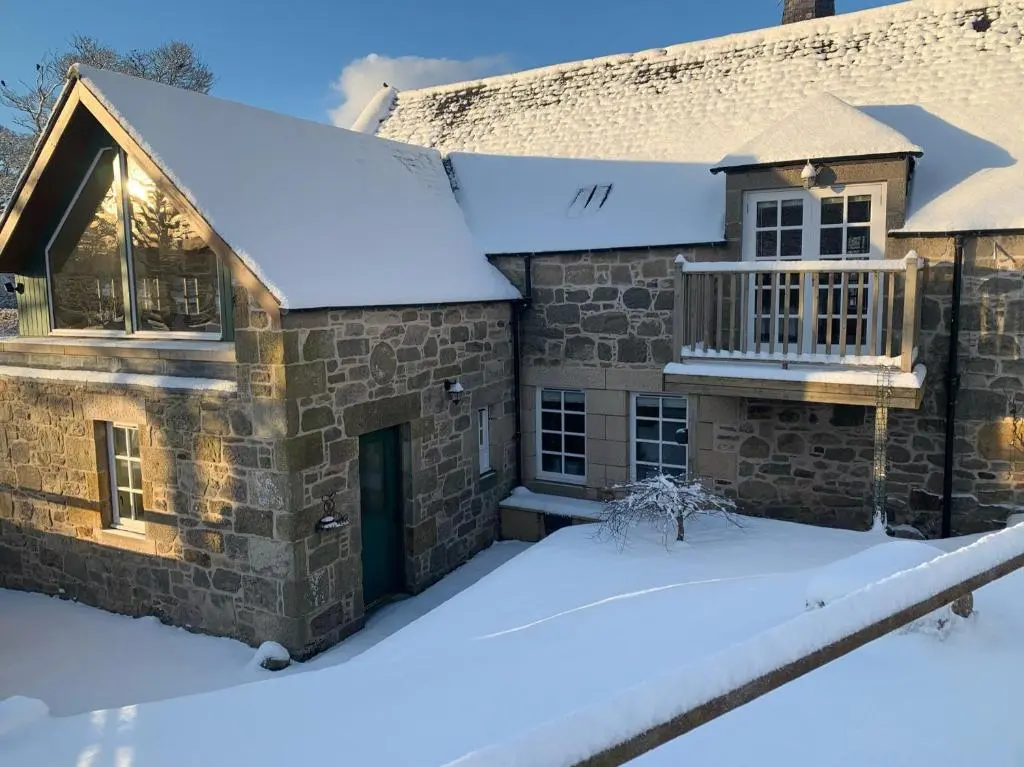 a house covered in snow at The Barley Mill in Elgin