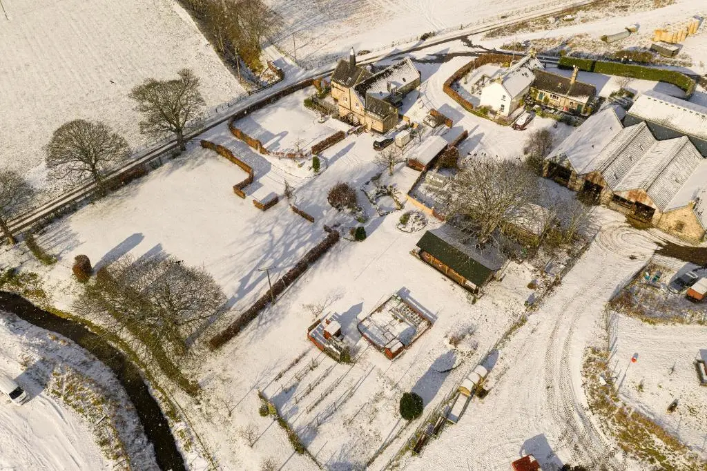 an aerial view of a yard covered in snow at The Barley Mill in Elgin