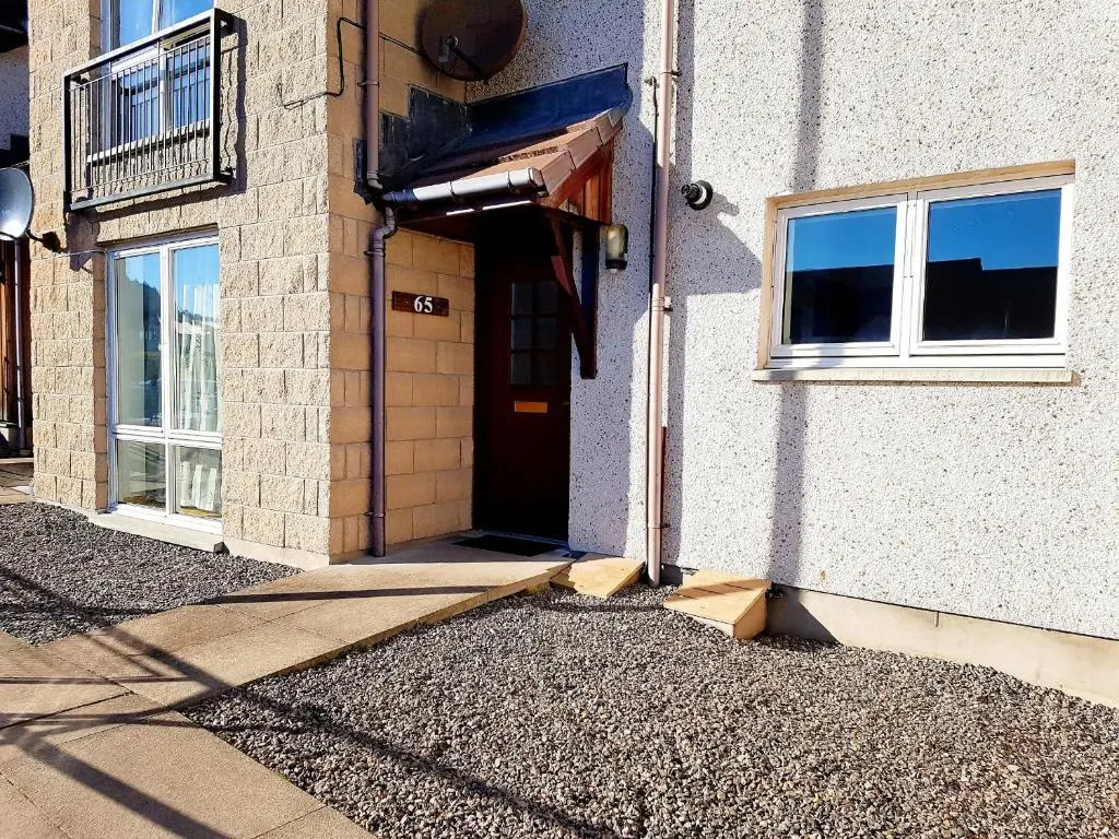 an entrance to a building with a door and windows at Hill View 2 bedroom free parking in Inverness