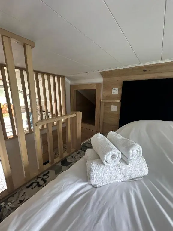 a bedroom with two towels on a bed at 2 Bed Self-Catering Lodge Inverness - Sleeps 4 in Inverness