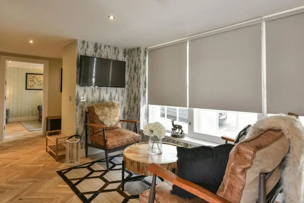 a living room with a couch and a table at The Seafield Arms Hotel Cullen - Self Catering in Cullen