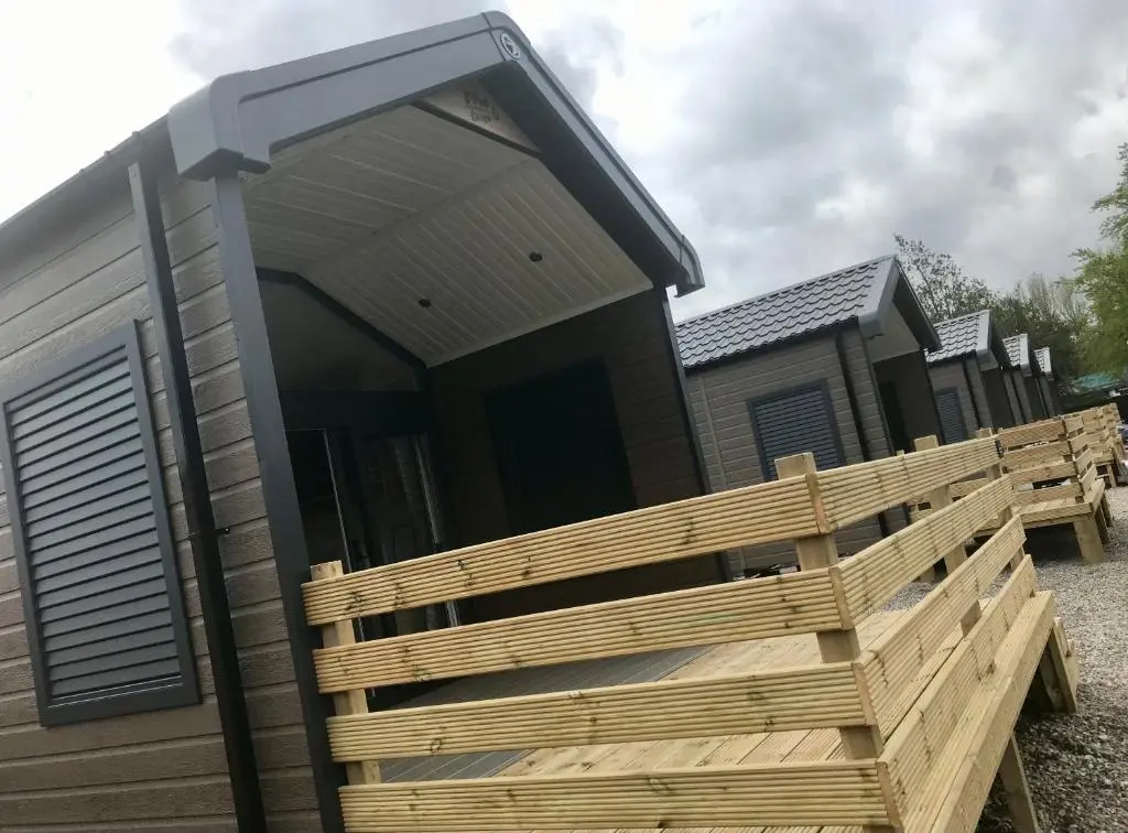a modular home with a wooden deck in front of it at Self-catering Lodge Inverness - Sleeps 4 in Inverness