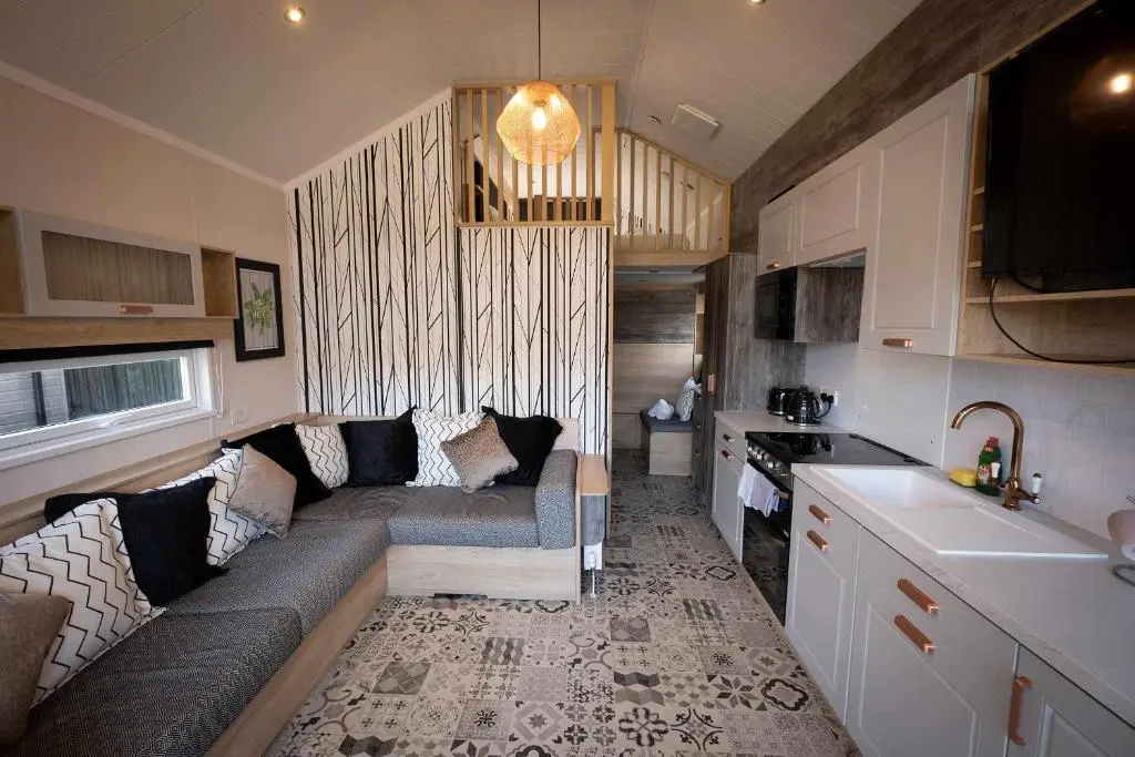 a living room with a couch in a kitchen at Self-catering Lodge Inverness - Sleeps 4 in Inverness
