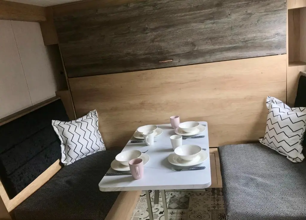 a white table with cups and saucers on it at Self-catering Lodge Inverness - Sleeps 4 in Inverness