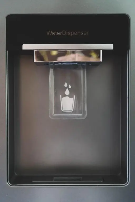 an open door of an oven with a water dispenser at The Nook Holiday Cottage in Aviemore