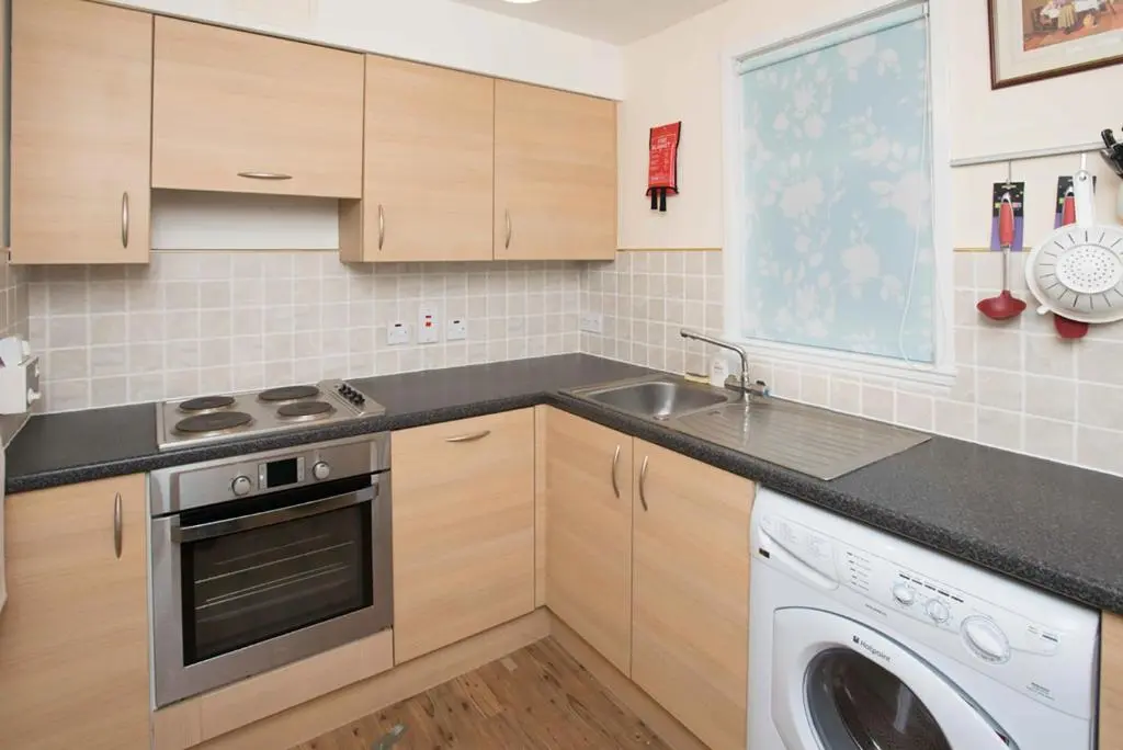 a kitchen with a sink and a dishwasher at Lovely 2 bedroom apt in Ballater on the River Dee in Ballater