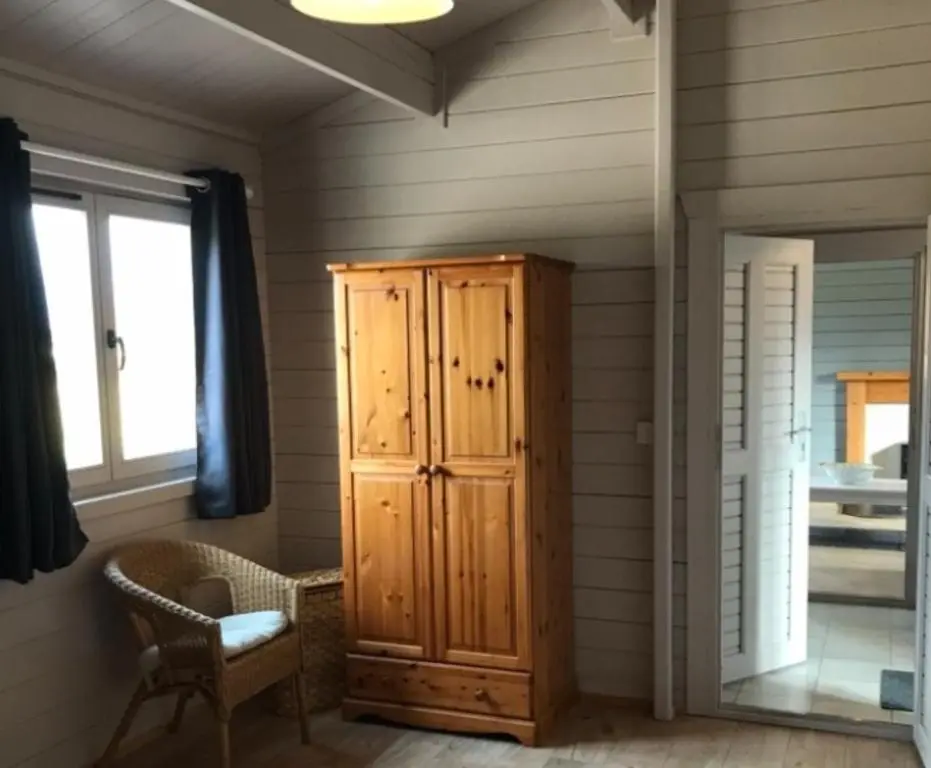 a room with a wooden cabinet and a window at Lovely 1-Bed House in Fochabers Scotland in Fochabers