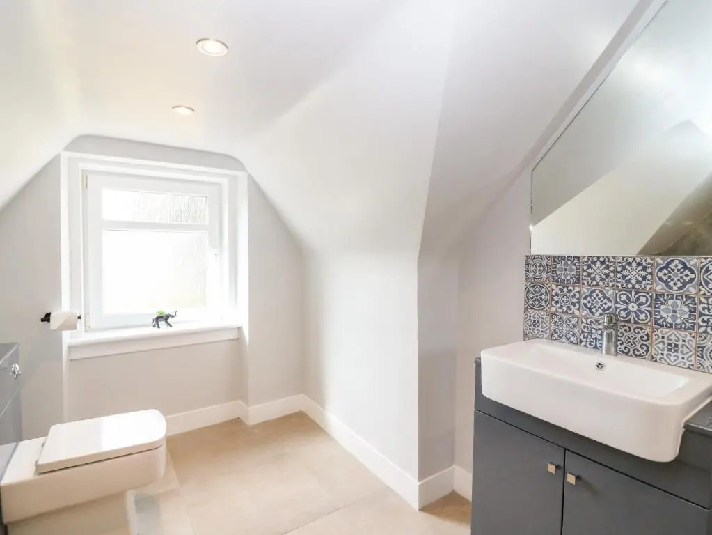 a bathroom with a sink and a toilet at Gairnlea House in Ballater