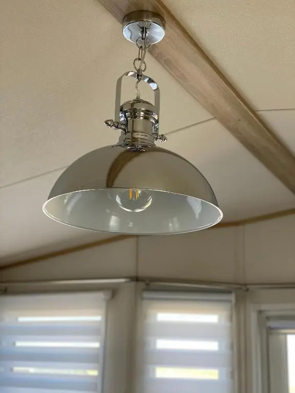 a ceiling light hanging from a ceiling at Beachfront Lodge, Lossiemouth Bay in Lossiemouth