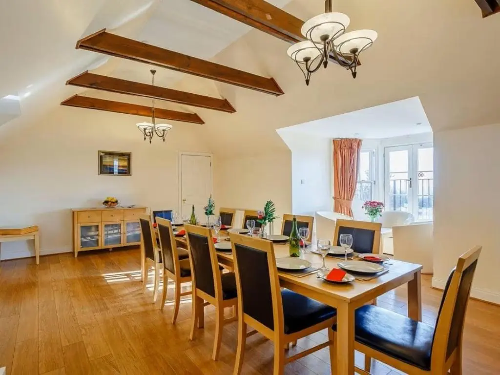 a dining room with a table and chairs at Craiglea Lodge & Barn in Latheron