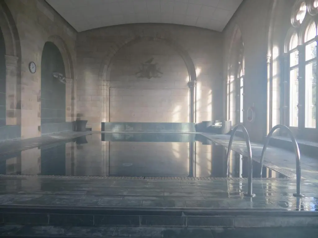 a room with a pool of water in a building at Glenwood Apartment at The Highland Club in Fort Augustus