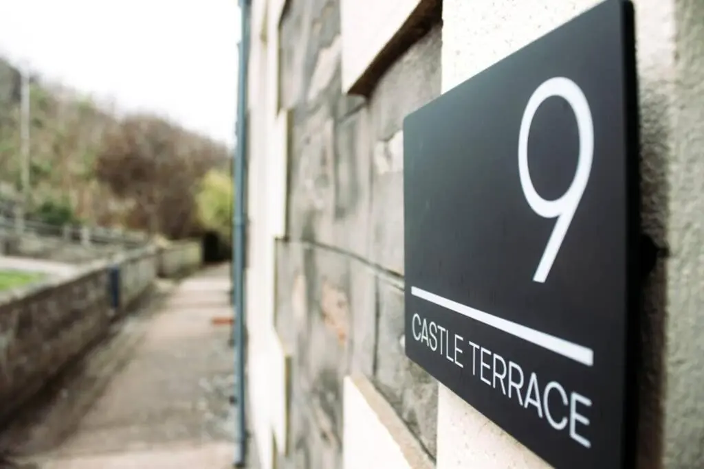 a sign on a building that reads castle heritage at Craigewan Cottage Seatown Cullen in Cullen