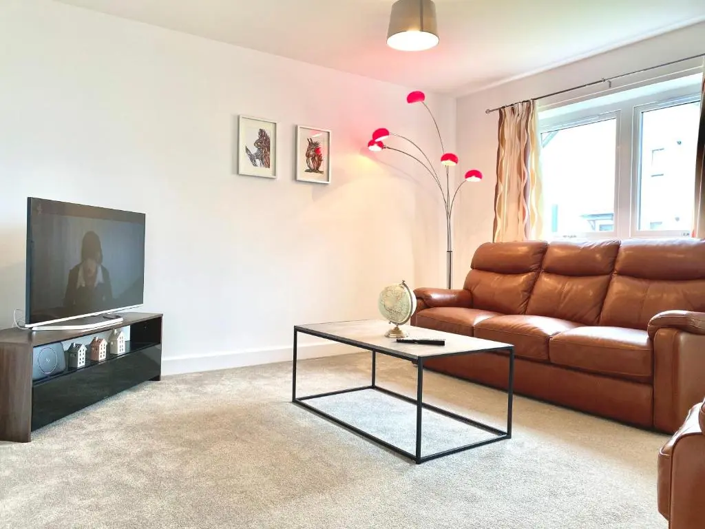 a living room with a couch and a coffee table at Serviced Accommodation Moray Cawdor Avenue, Elgin in Elgin