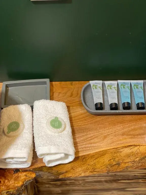 a wooden table with towels and a tray with at Shore Street Apartments in Inverness