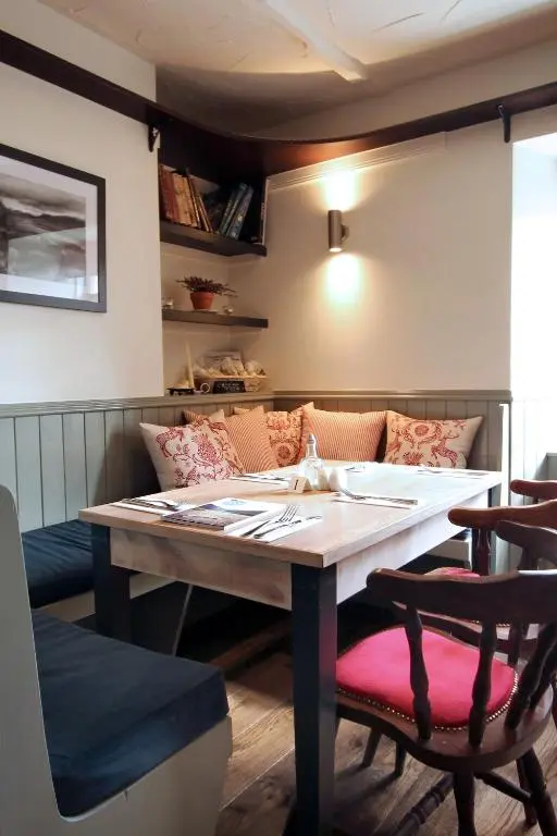 a dining room with a table and chairs at The Boat Inn in Aboyne