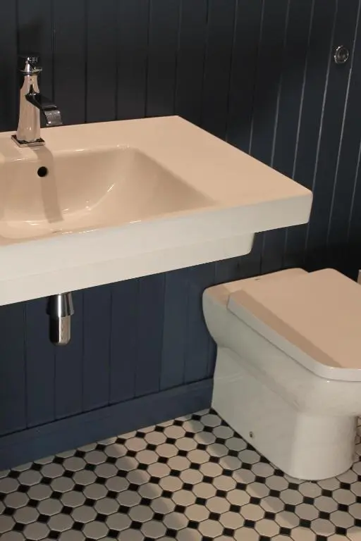 a bathroom with a white sink and a toilet at The Boat Inn in Aboyne