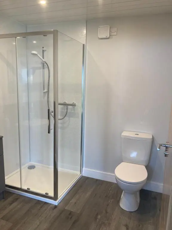 a bathroom with a shower and a toilet at North Coast Escapes in Thrumster