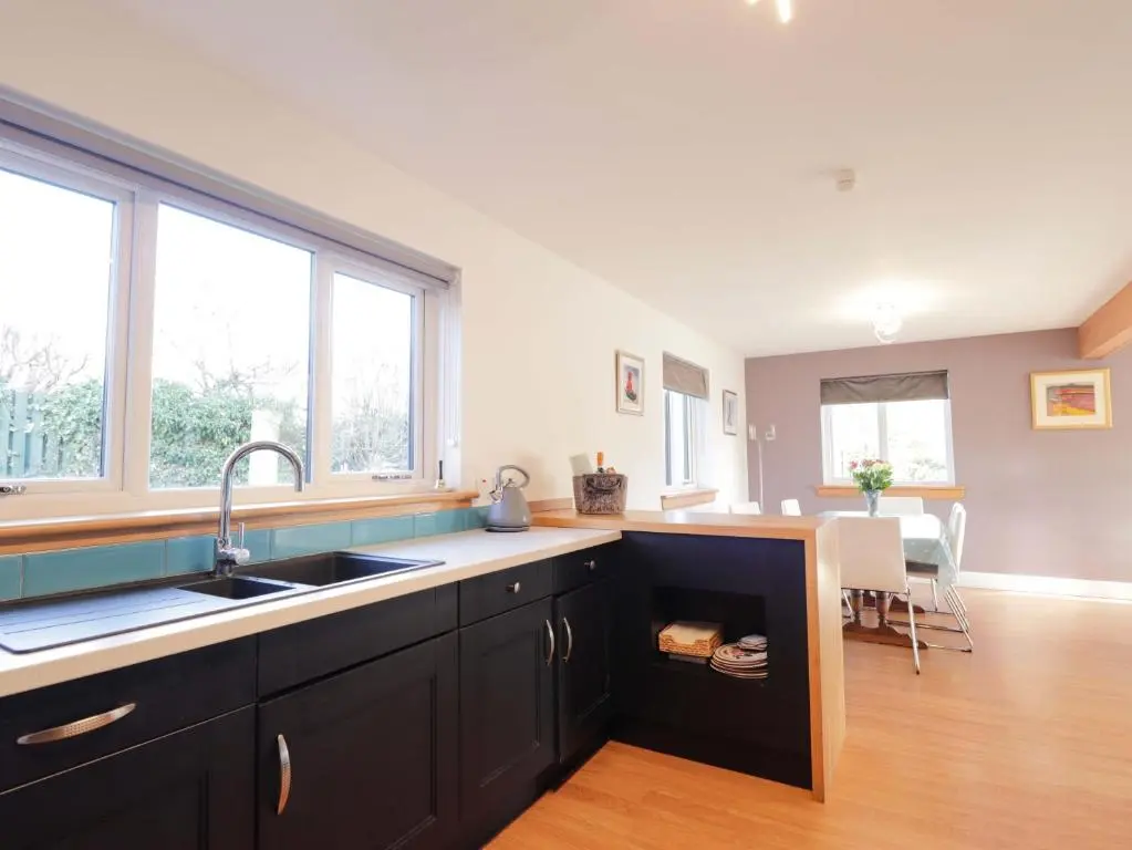 a kitchen with a sink and a counter top at 3 Croftside in Aviemore