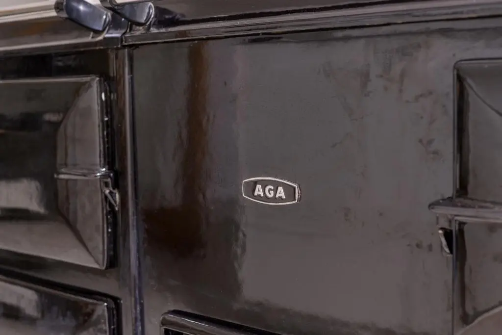 a black stove with aania label on the door at Haven Retreat Scotland - Large 4 Bed House with Woodland garden, Aboyne ,Royal Deeside in Aboyne