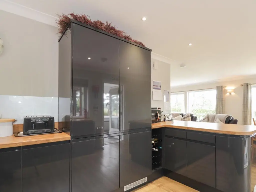 a kitchen with a large glass wall at Culreach Lodge in Grantown on Spey