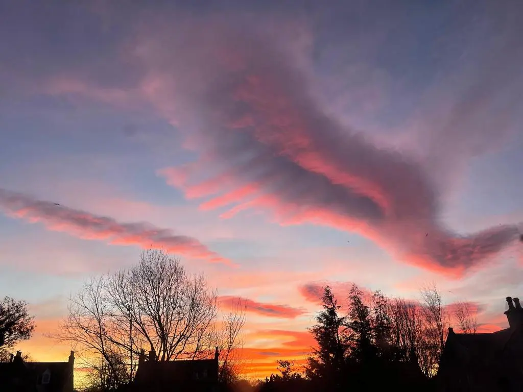 a sunset with a cloud formation in the sky at Monkland Cottage in Nairn